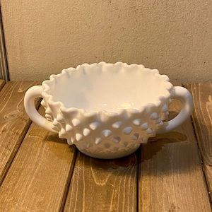 White little cup with handles.